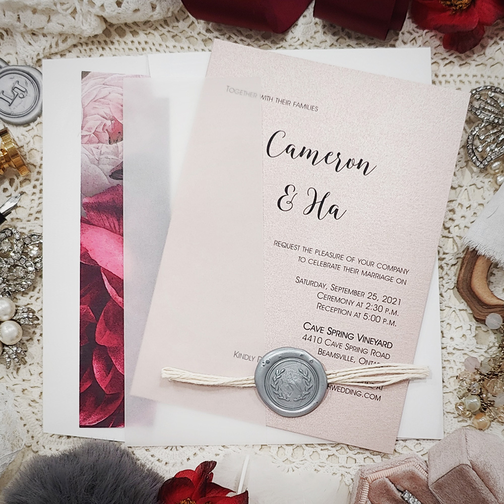 Invitation 3202: Blush Pearl, Silver Wax, String Ribbon - This is a blush pearl invite wrapped with a clear vellum wrap and finished with a string and silver wax seal combo.