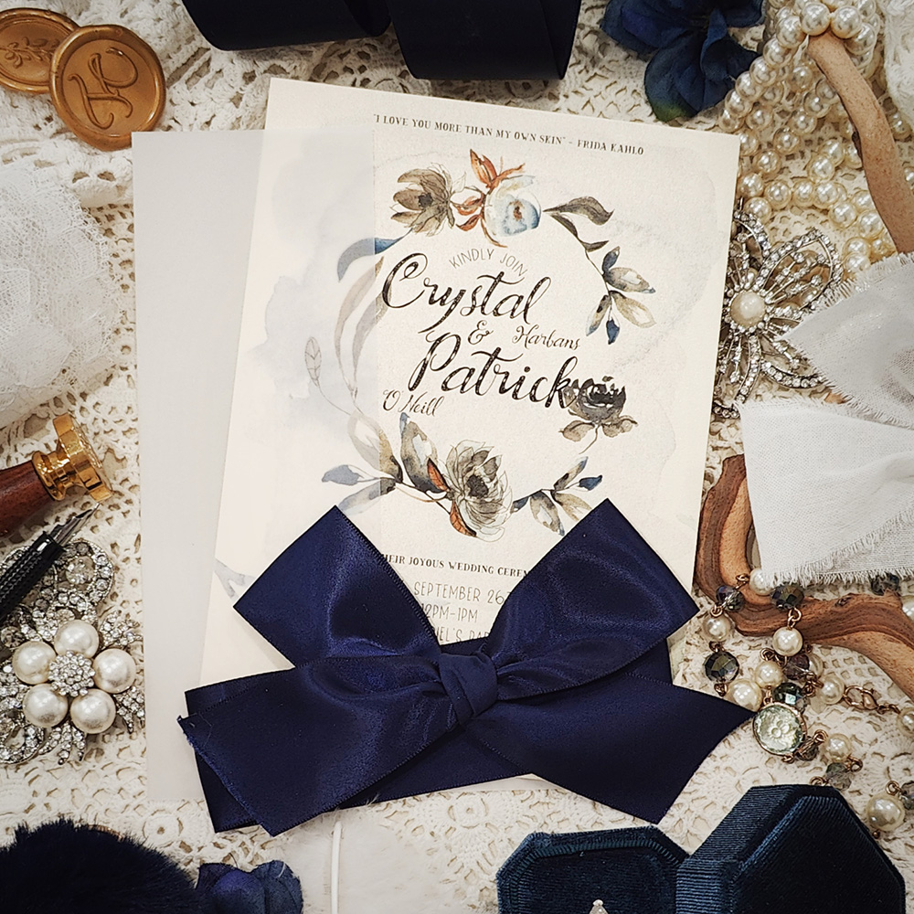 Invitation 3204: White Gold, Navy Ribbon - Single card wedding invite with a clear vellum wrap and big navy bow tied around.
