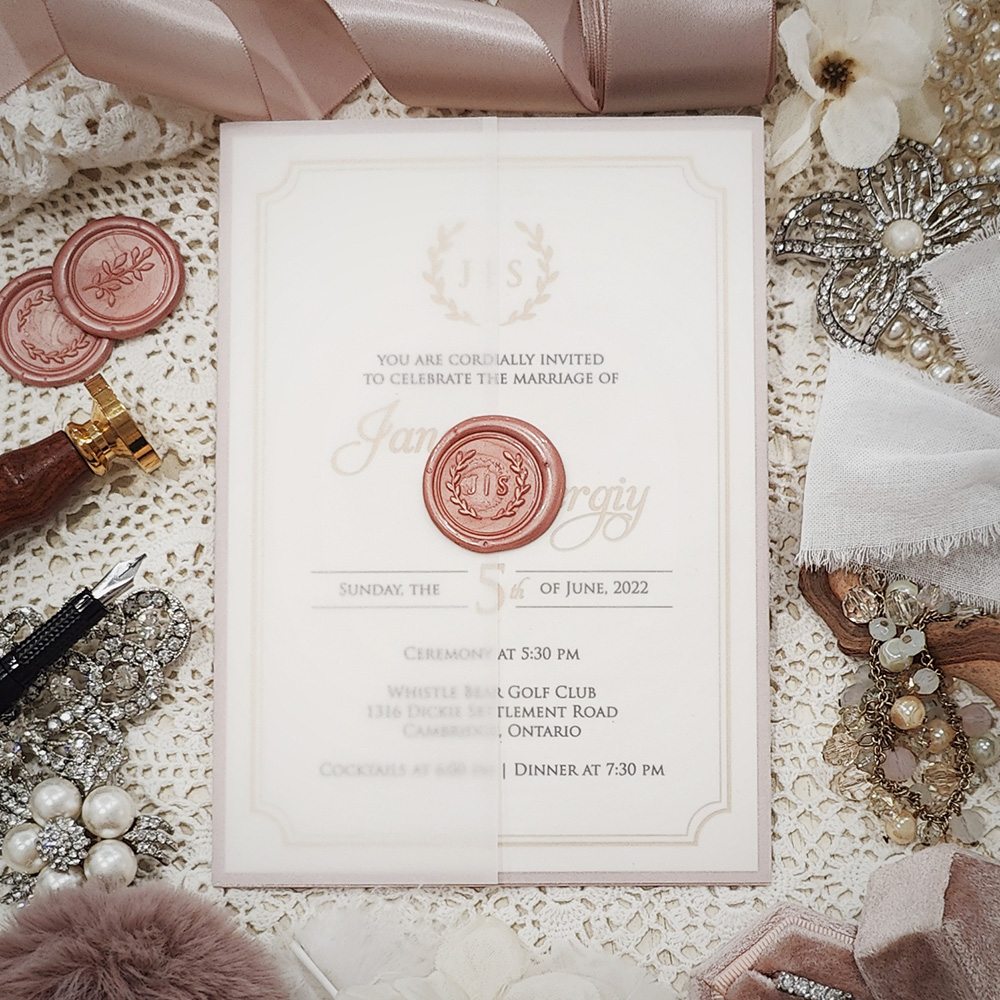Invitation 3226: Ivory Pearl, Blush Pearl, Blush Wax - This is a layered invite with a blush pearl backing.  It is wrapped with a clear vellum wrap and blush wreath wax seal.