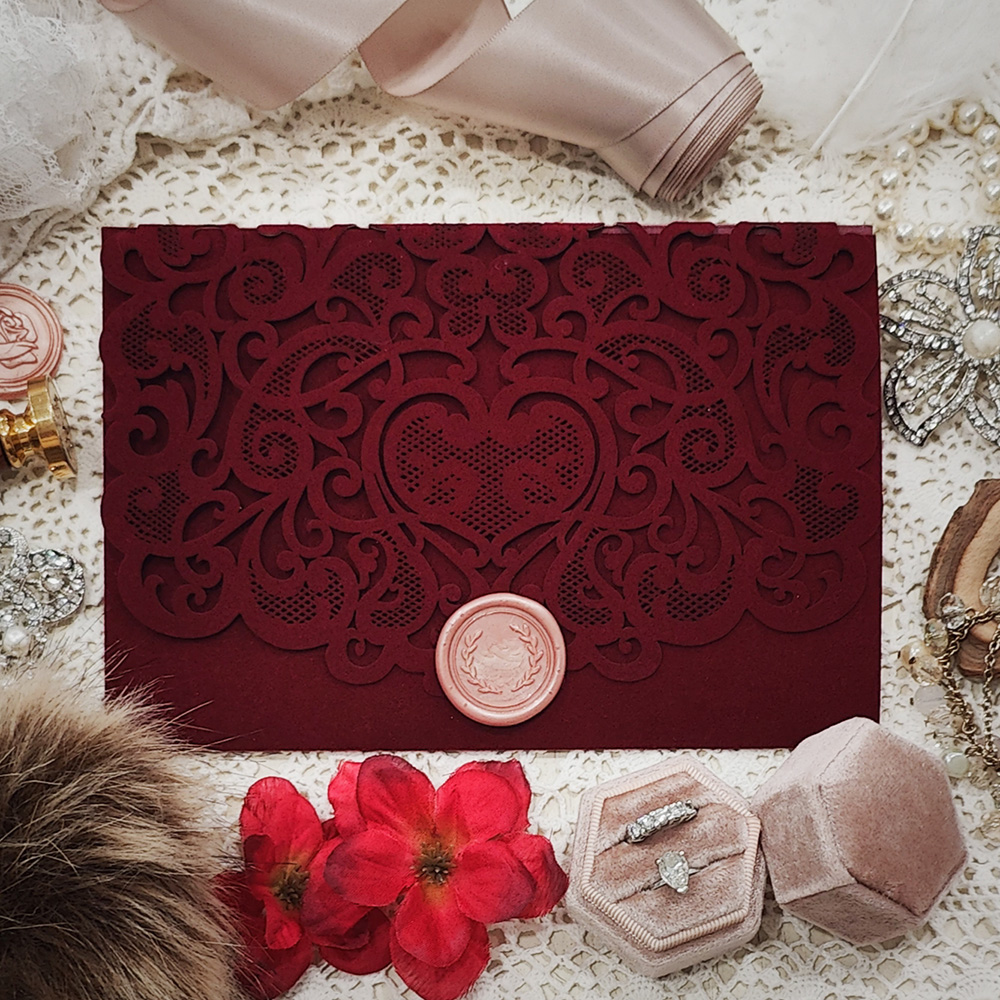 Invitation 5403: Burgundy Velvet, Cream Smooth, Blush Wax - Sherry Velvet damask pattern laser cut pocketfolder with a blush wreath wax seal.