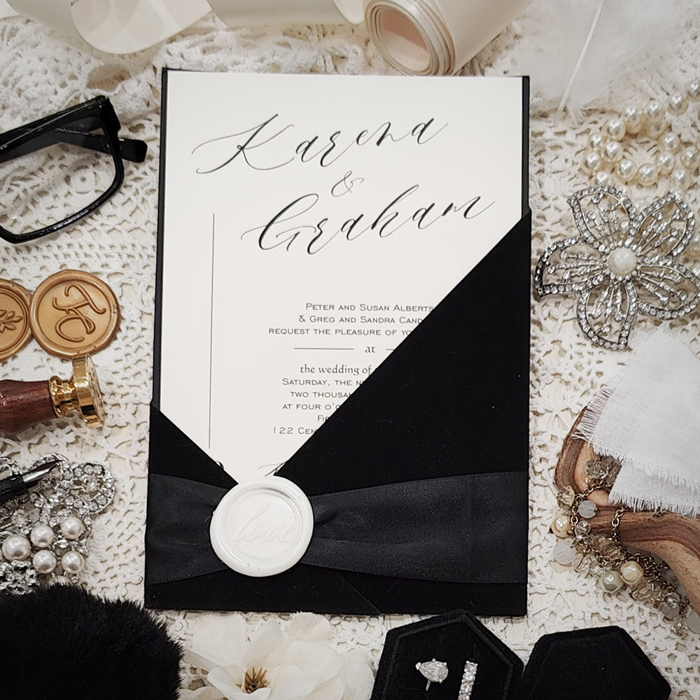 Invitation 5412: Black Velvet, Cream Smooth, Ivory Wax, Black Ribbon - Black velvet wedding pocket style with a black ribbon and ivory wax seal.