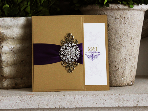Invitation 778: Gold Pearl, Cream Smooth, Purple Ribbon, Brooch/Buckle X, Metal Filigree F4 - Bronze - Gold Pearl pocket style invite with a ribbon and brooch embellishment
